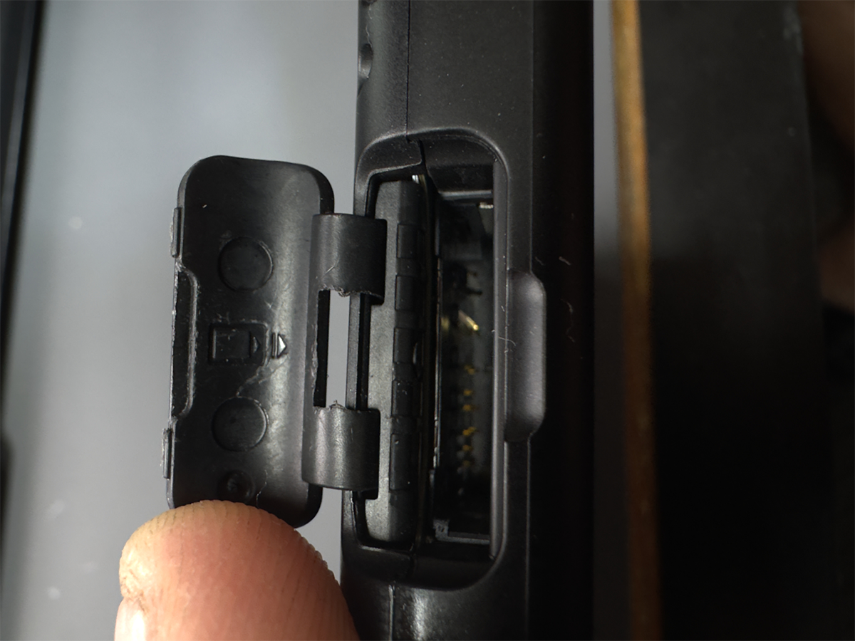 Nintendo Switch game card reader showing bent contact pins